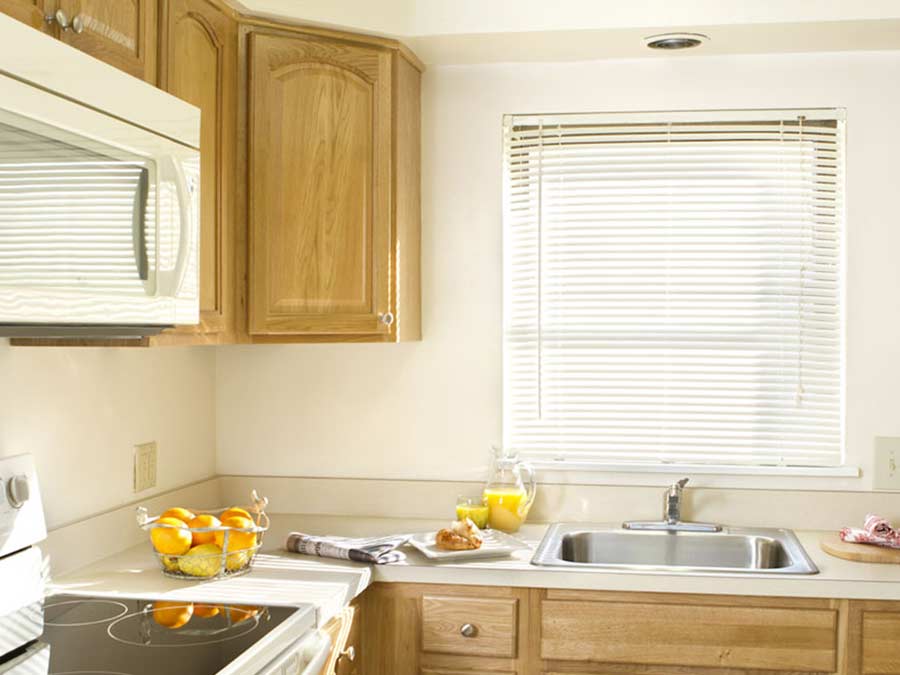 Spruce Court Apartments kitchen with white appliances